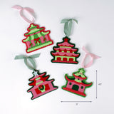 Four colorful pagoda-shaped felt Christmas ornaments with ribbon loops, each measuring about 4.5 inches tall and 5 inches wide.