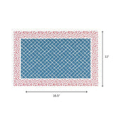 A blue trellis patterned paper placemat with a red ditsy floral border displayed with 16.5" by 11" dimensions on a white background.