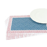 A stacked set of paper placemats featuring a blue trellis pattern with a red ditsy floral border beside a white plate.