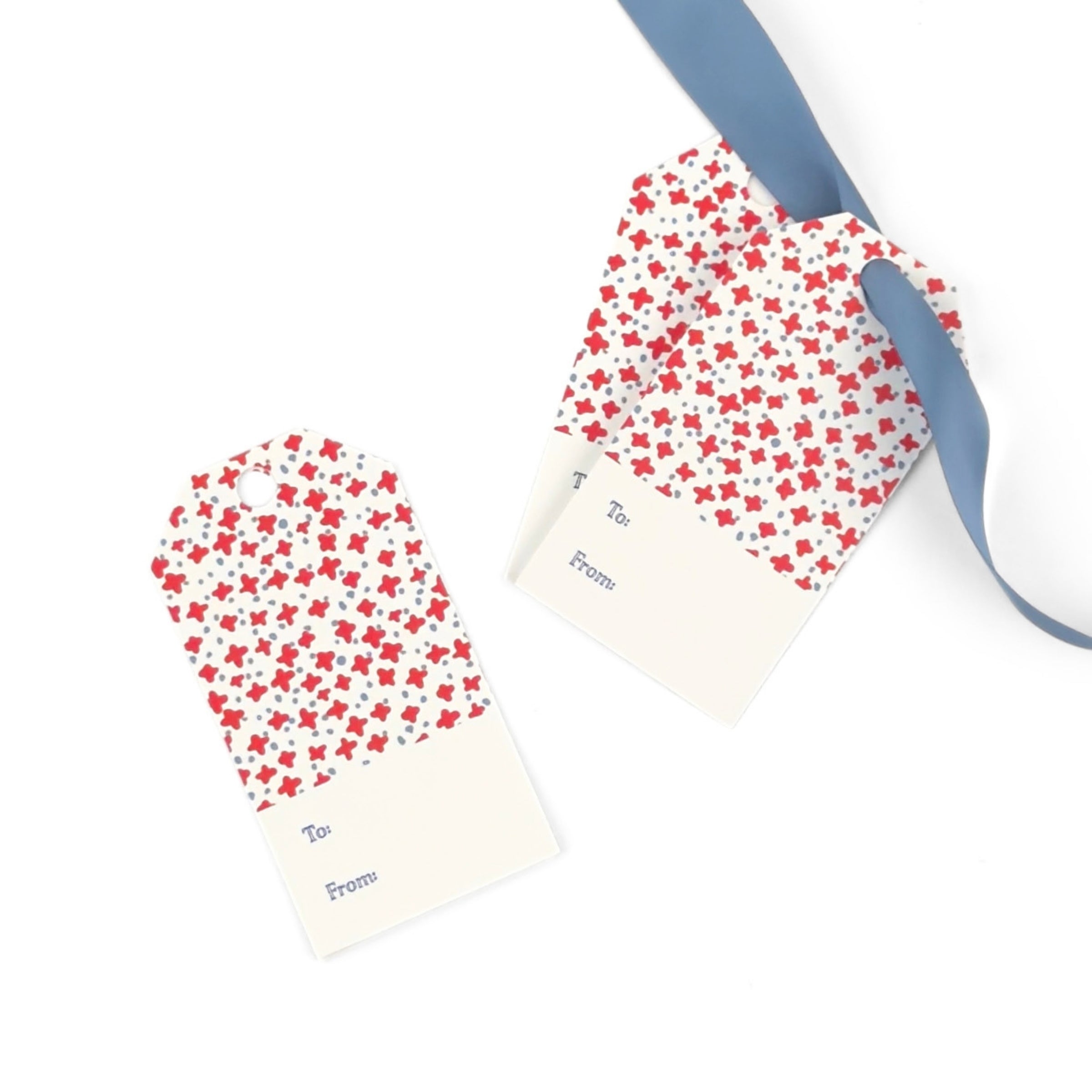 Dune Road gift tags featuring charming red floral stars, delicate blue accents, and personalized fields.