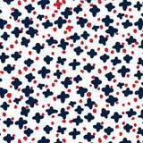 Navy blue starburst and red dot ditsy pattern fabric on a white background.