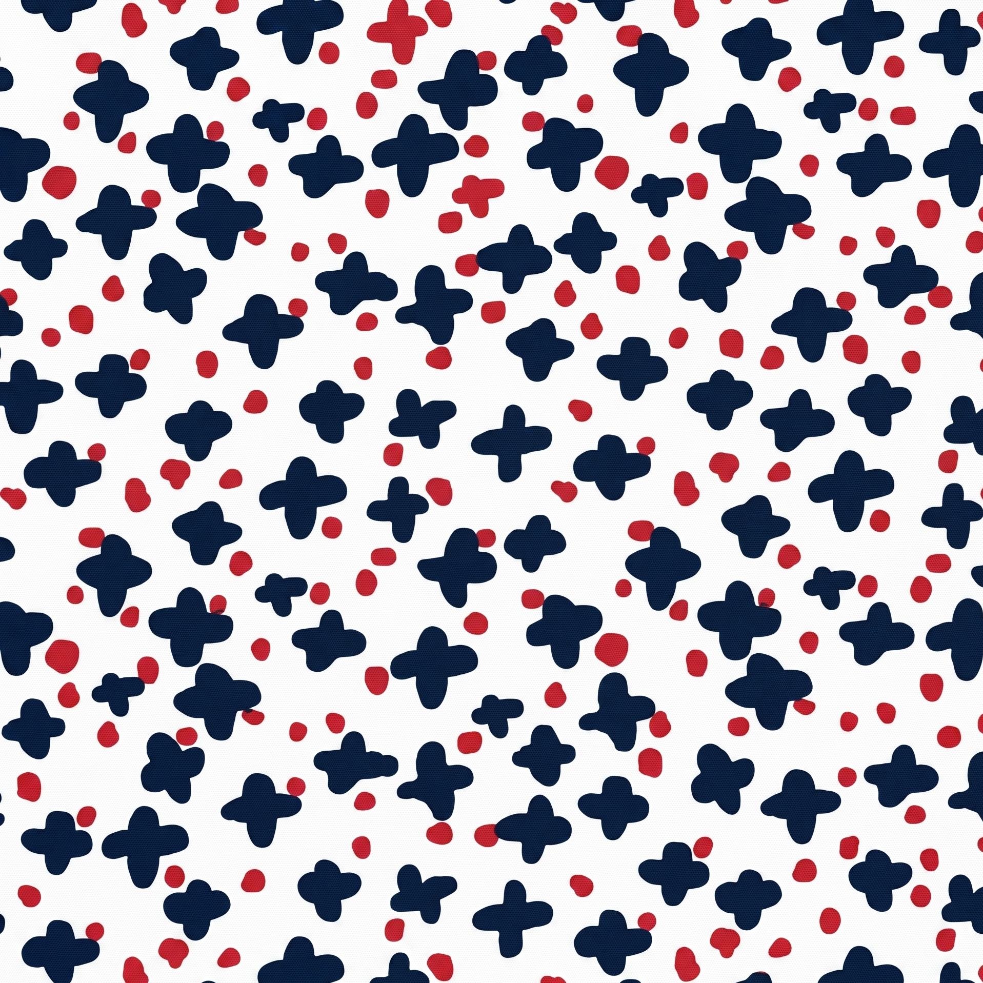 Navy blue starburst and red dot ditsy pattern fabric on a white background.