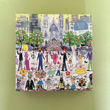 Illustrated 500-piece puzzle showing a lively Easter parade in a city park with people, costumes, and spring decorations
