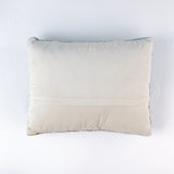 reverse side of a derby day pillow featuring a horse and jockey