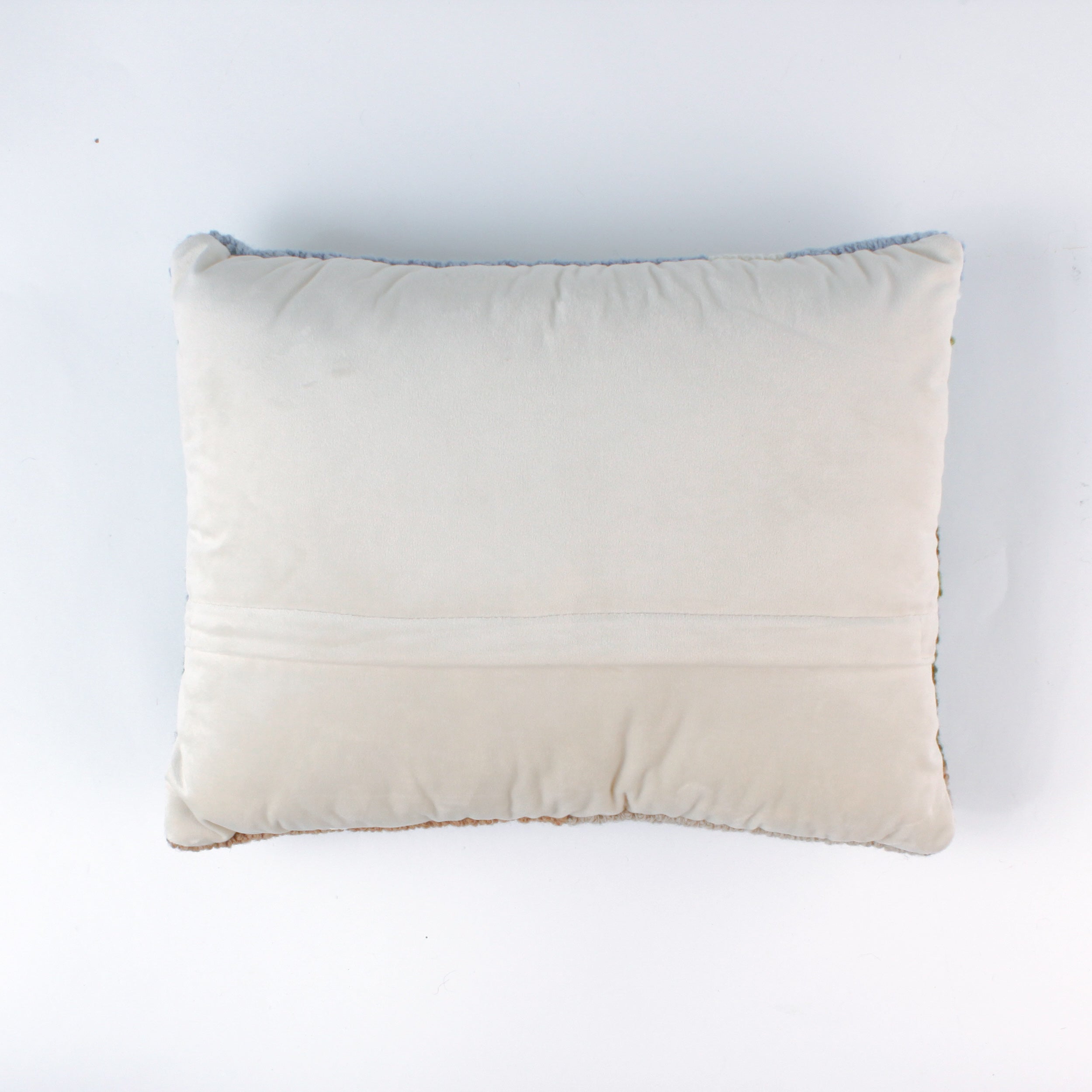 reverse side of a derby day pillow featuring a horse and jockey