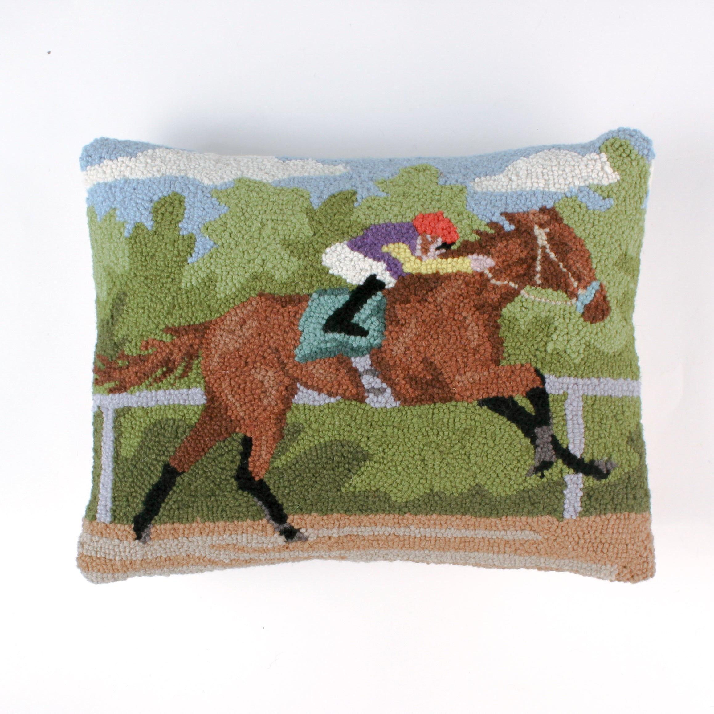 a hooked wool derby day pillow featuring a brown horse and mulitcolor jockey