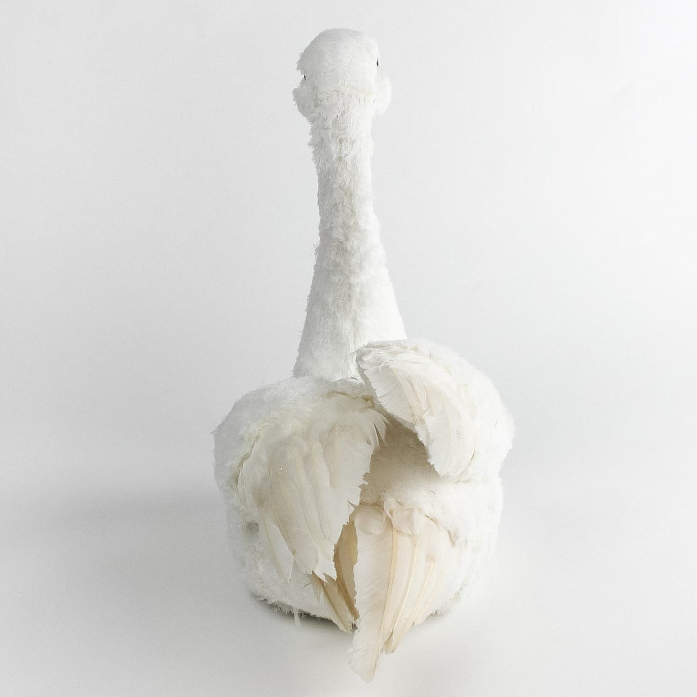 back view of a Feathered Swan Centerpiece in a white background 