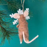 back of one felt mouse ornaments wearing white snowflake costume frame hanging from pine branches