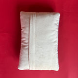 back of a Rectangular light blue pillow featuring a red, white, and blue Uncle Sam hat with stars bursting from the top, symbolizing a patriotic USA theme.
