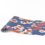Floral red white and blue paper table runner with bold colorful floral pattern design.
