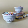 small green ceramic bowl with candy