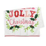 A Madcap Cottage Christmas tea towel with holly motifs and text that reads Have a Holly Jolly Christmas