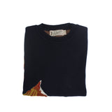 Folded navy blue knit sweater with subtle fox motif detail and branded label visible