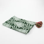 Green pineapple pattern Christmas tea towel with pink and green tassels on each corner