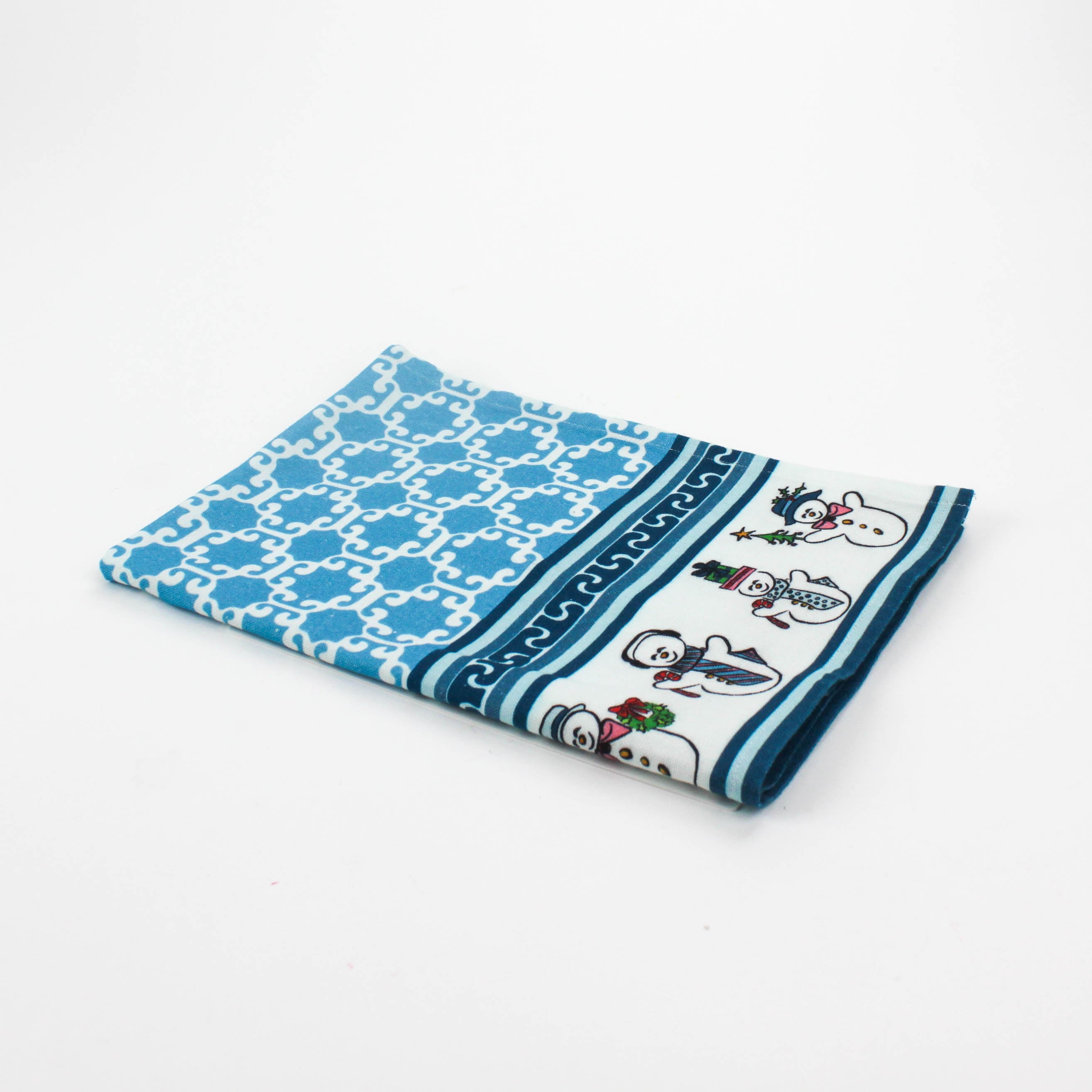 Folded Christmas tea towel featuring a blue lattice pattern with a festive border of cheerful snowmen wearing scarves, hats, and ties in various holiday poses.