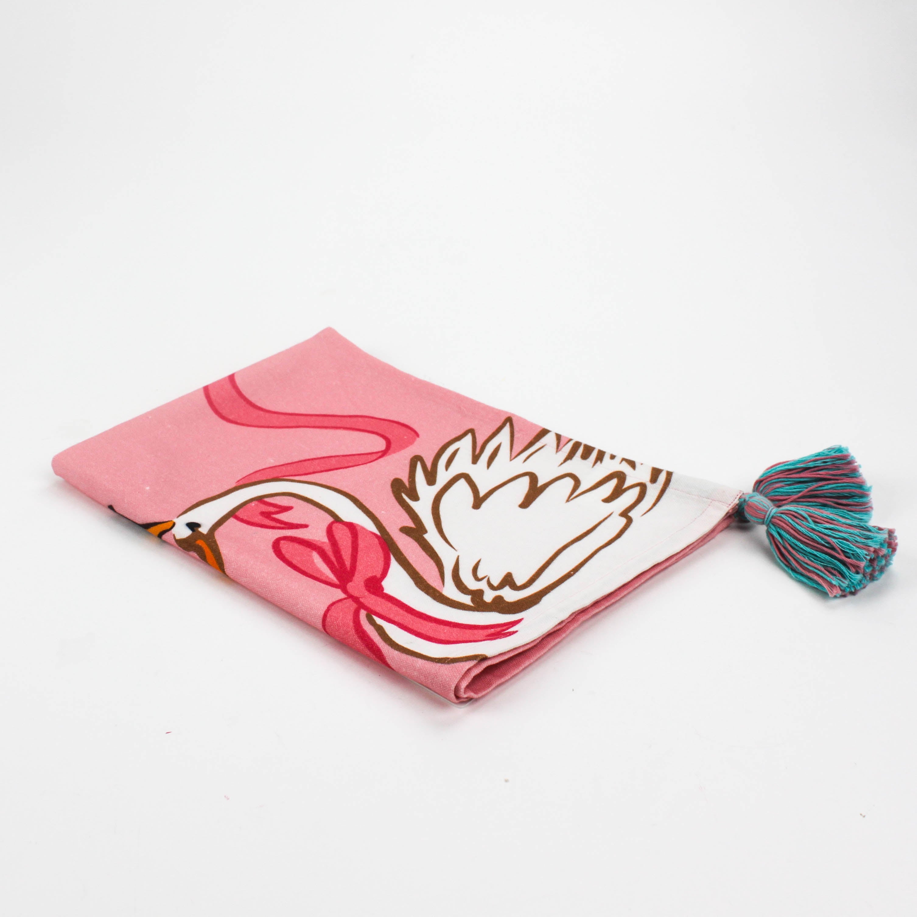 Christmas tea towel designed with a white swan with a golden crown and pink ribbon on a pink background 