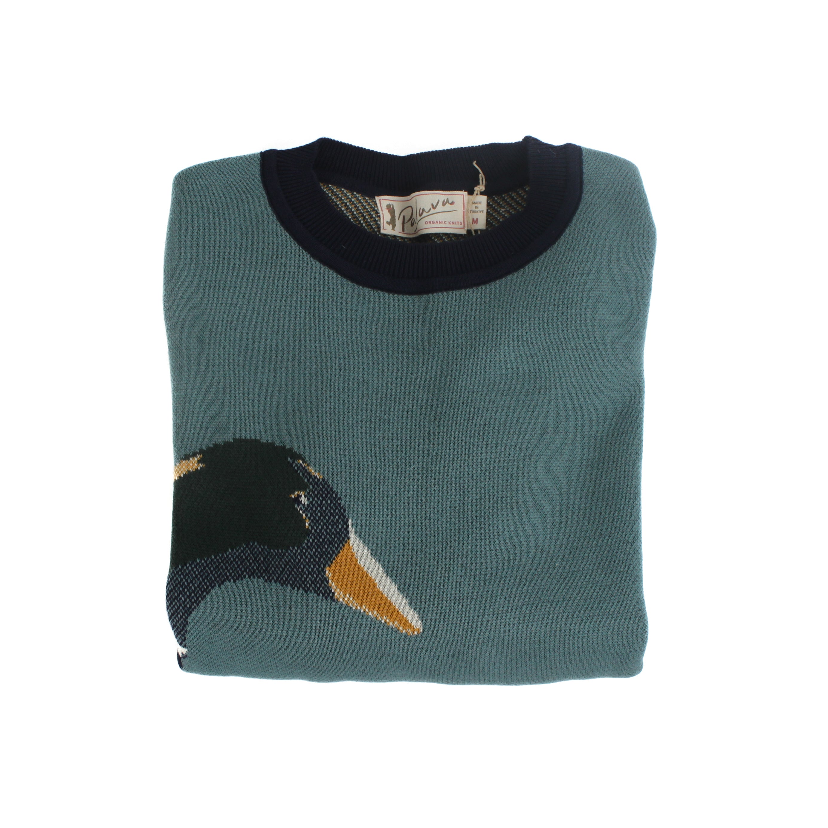 Folded teal knit sweater with mallard duck motif and visible branded label