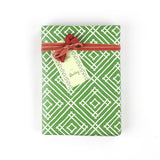 a wrapping paper with a geometric lattice pattern in green