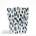 a blue and white wastepaper basket with a brushtroke motif pattern called club house from madcap cottage