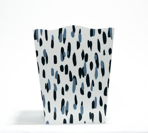 a blue and white wastepaper basket with a brushtroke motif pattern called club house from madcap cottage