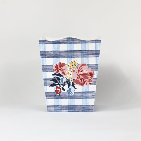 a blue floral wastepaper basket in a gingham pattern with a central floral motif from madcap cottage. 