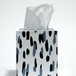 A blue and white tissue box covered with a brushtroke motif pattern called club house by madcap cottage