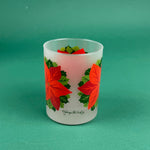Frosted clear glass with a bright red poinsettia and green holly leaf design on a green background