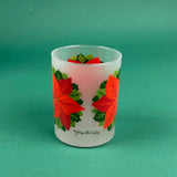 Frosted clear glass with a bright red poinsettia and green holly leaf design on a green background