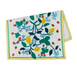 a lemon and strawberry tea towel with blue flowers and a yellow and green border against a white background. 