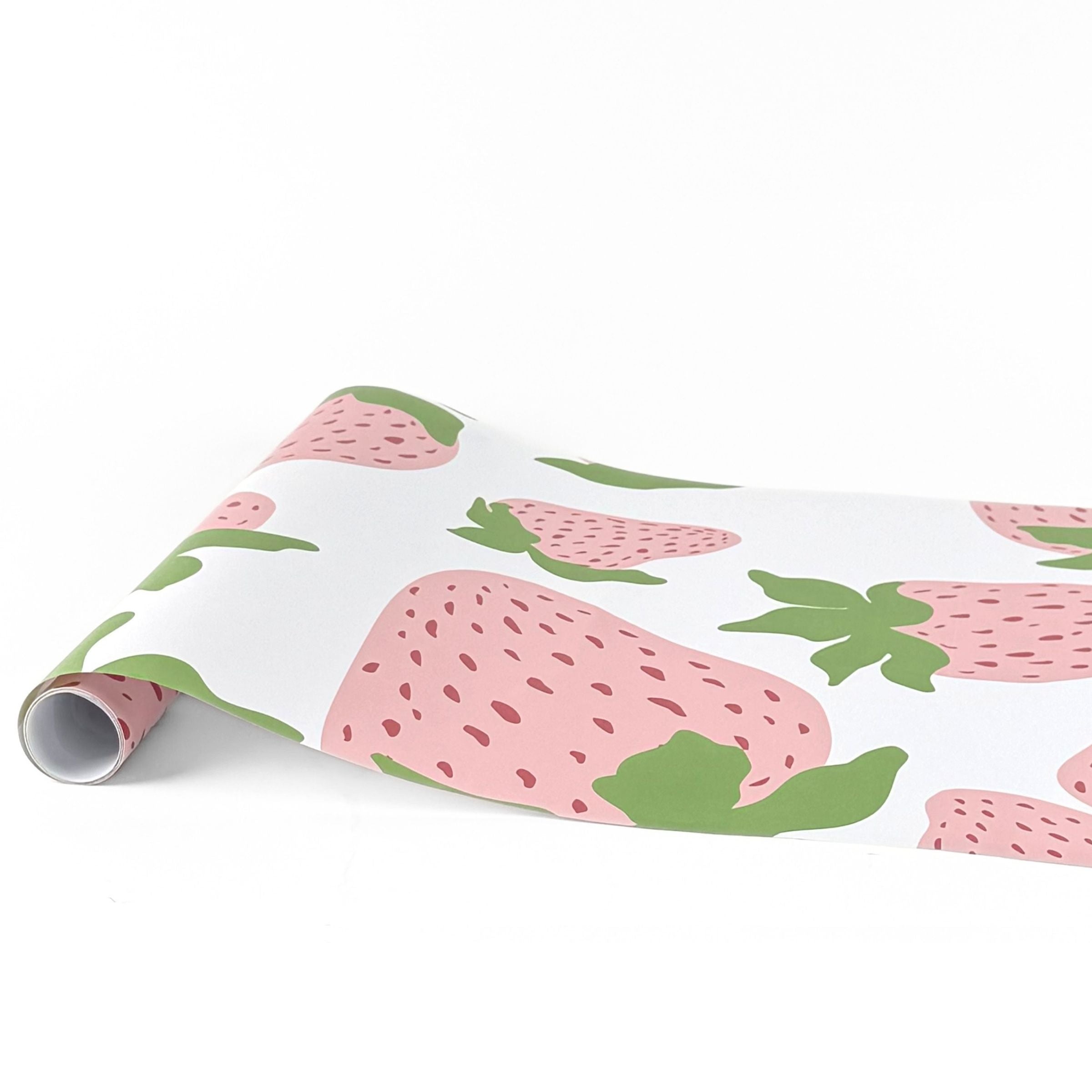 Garden strawberry pink green paper table runner with oversized strawberry pattern design.