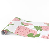 Garden strawberry pink green paper table runner with oversized strawberry pattern design.