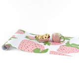 Garden strawberry pink green paper table runner styled with matching mug and bowl.