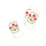 Elegant gift tags featuring vibrant red geranium flowers, lush green leaves, decorative borders, and personalization fields.