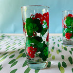 a vintage glasses set of six glasses with red and green geranium motifs.