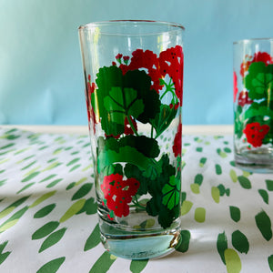 a vintage glasses set of six glasses with red and green geranium motifs.