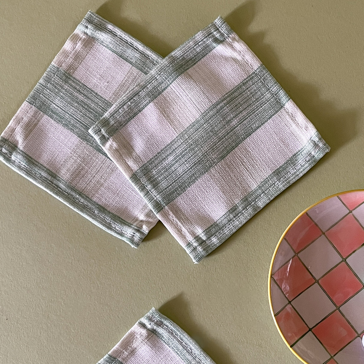 Gin Lane gingham cloth cocktail napkins in Meadow green with a checkerboard dish
