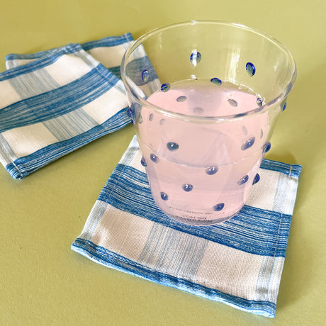 gin lane swedish blue cloth cocktail napkins with a blue dotted glass