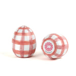 a pair of pink gingham decorative Easter eggs on white background, one showing the bottom part