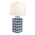 A navy and white gingham porcelain lamp with a white shade