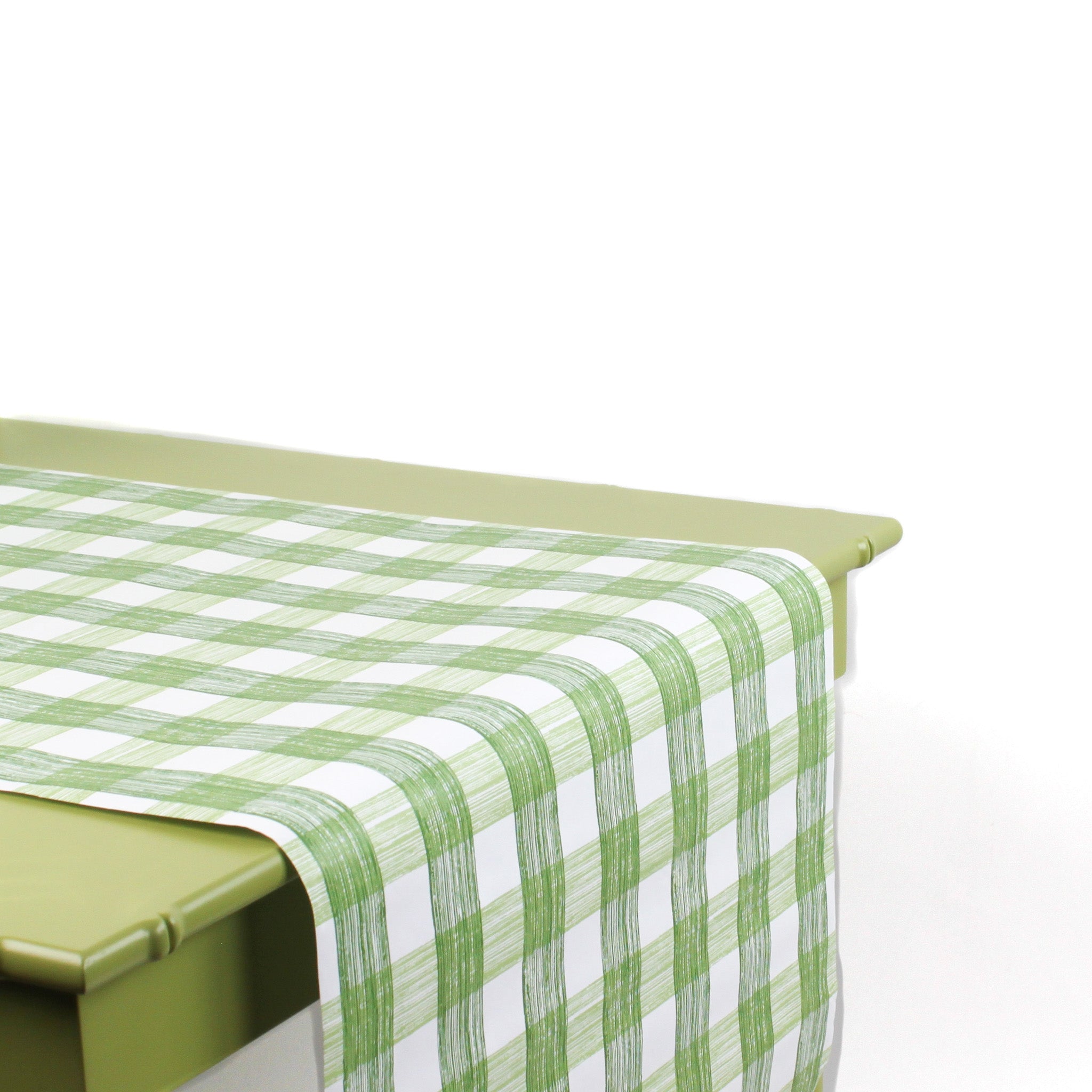a green table covered by a Gin Lane Green Gingham Paper Table Runner on a white background