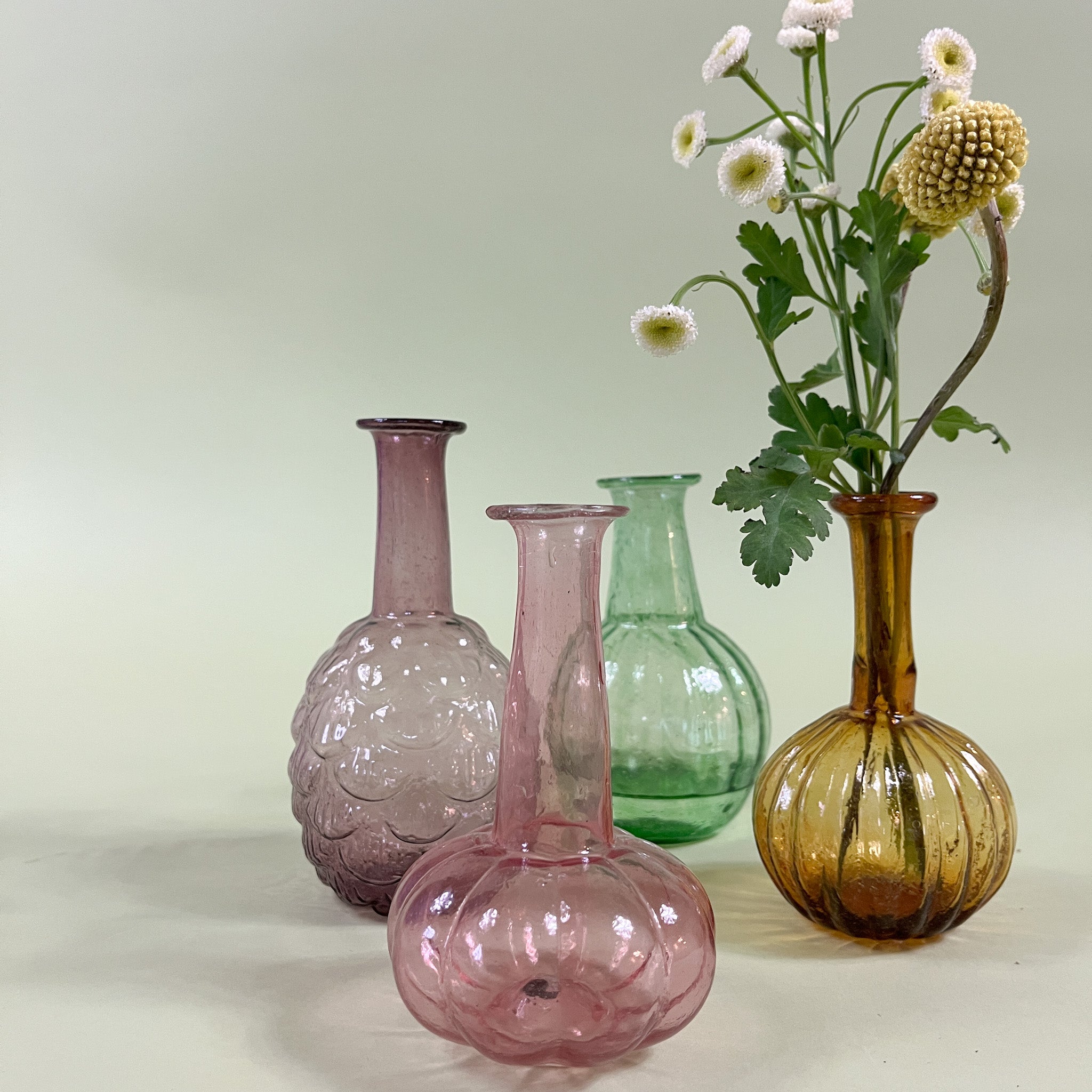 four Colorful Blown Glass Bud Vases