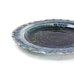 a glazed blue ceramic dinner plate from madcap cottage