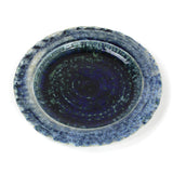 a glazed blue ceramic dinner plate from madcap cottage