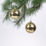 2 mini gold disco ball ornaments on a white background