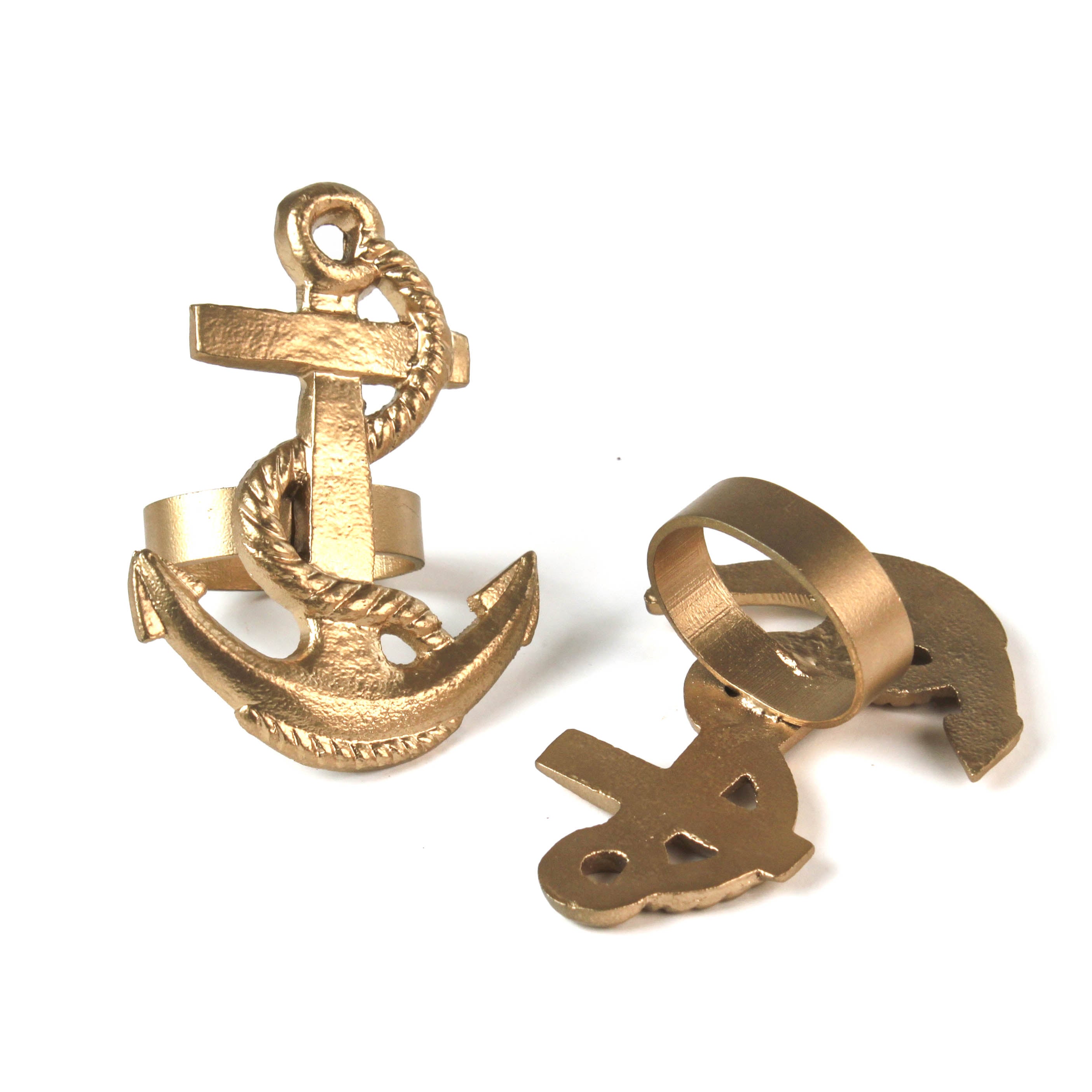 two metal anchor napkin rings on a white background. 
