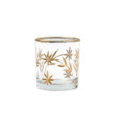 Clear glass candle holder with gold floral design on a white background