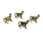 Set of four gold monkey-shaped napkin rings displayed on a white background.