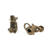 Two gold mouse candle holders on a white background