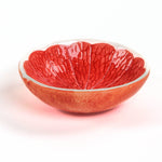 grapefruit shaped ceramic bowls with a textured surface on a white background