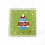 a medium green square Acrylic Trays with Ornament motif on it on a white background